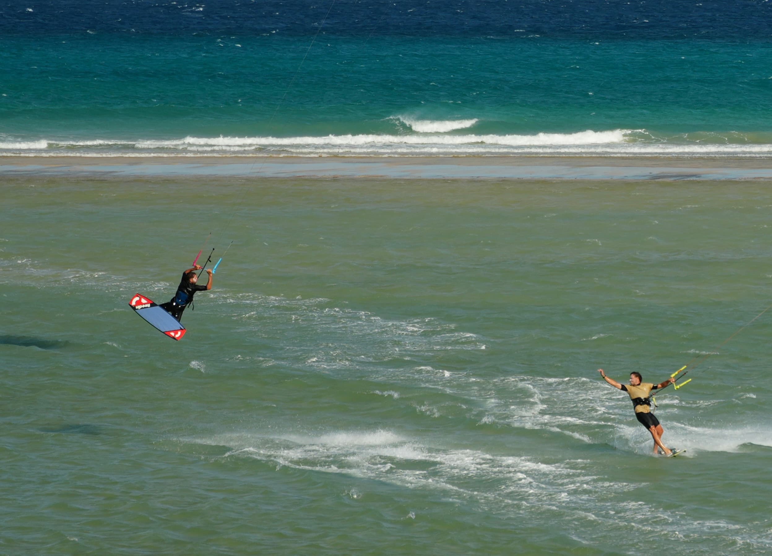 Fuerteventura kitesurfing — rider in action on Atlantic swell, Canary Islands, Spain